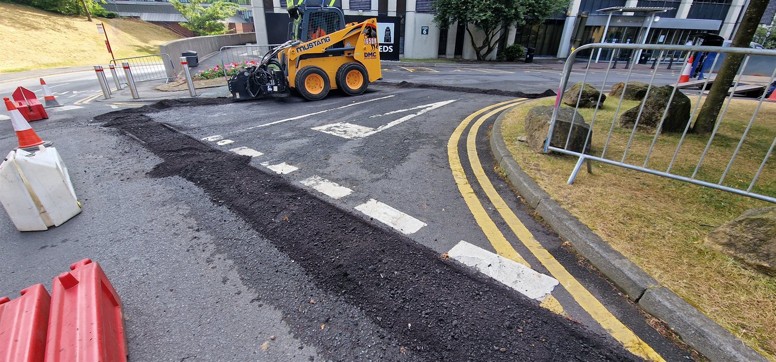 Planing machinery removing failed asphalt during preparation
