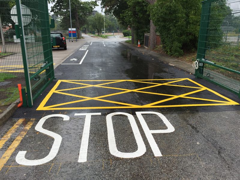Completed asphalt roadway with fresh road markings