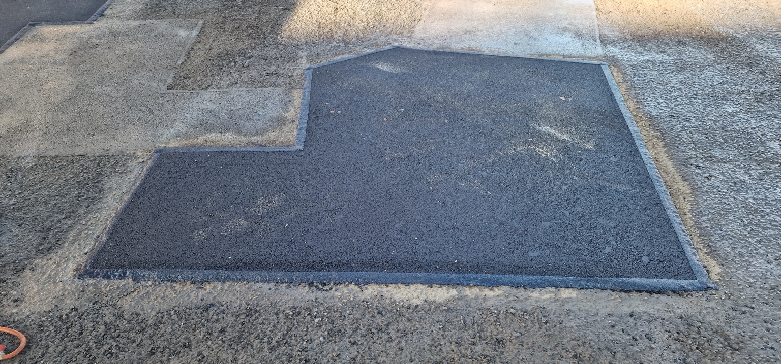 Completed asphalt patch in the same Harrogate car park
