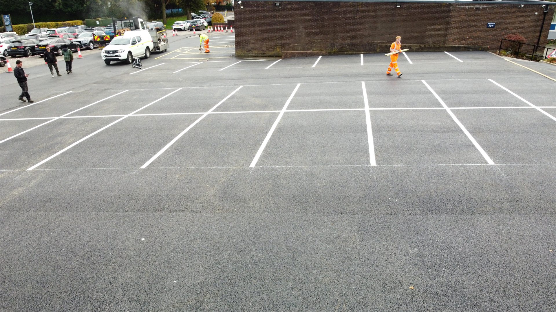 Finished asphalt and white bay markings at Sand Moor Golf Club