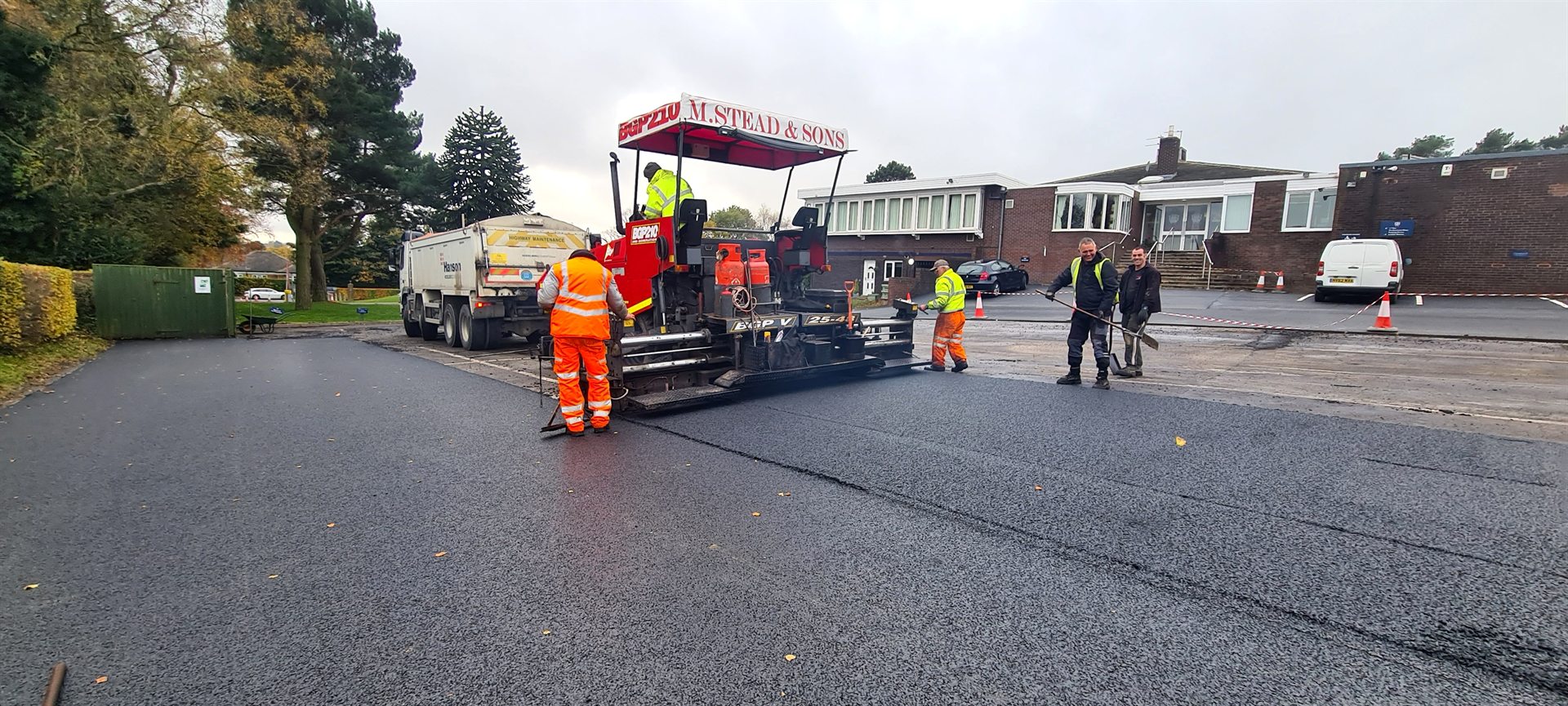 Atkinson Surfacing crew operating a paver at Sand Moor Golf Club